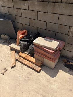 Bricks, wood and sand bags