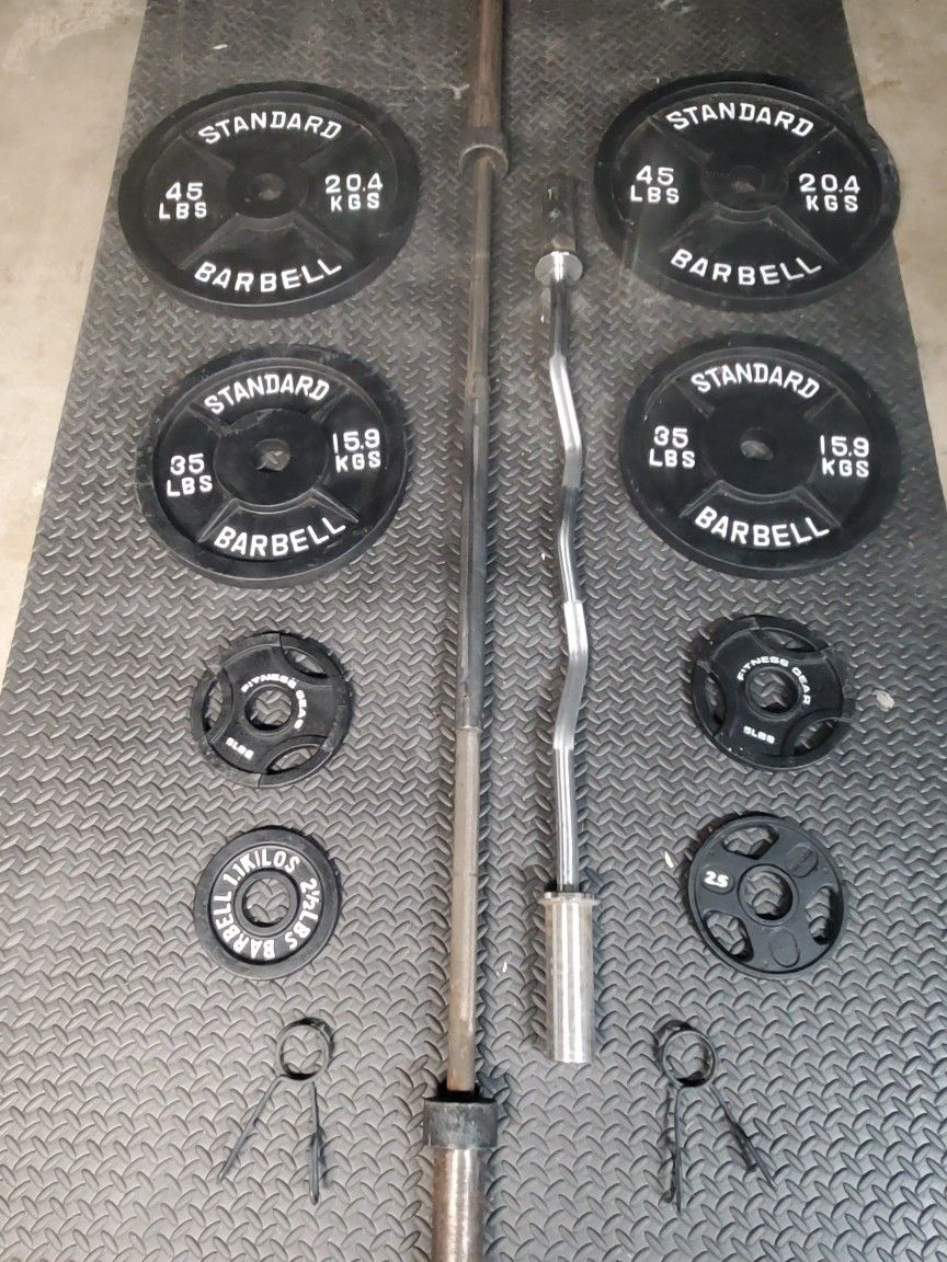 Olympic Weight Set With Olympic Bar & Curl bar..210lbs all together read Description below...