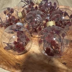 Set of 7 clear ornaments with burgundy flowers $10