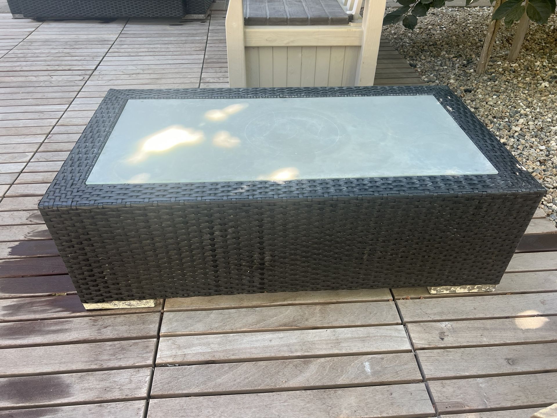 Used - frosted glass, wicker coffee table.