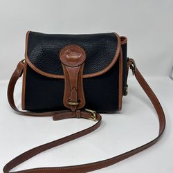 Vintage Dooney and Bourke black/tan pebble all weather leather purse. 