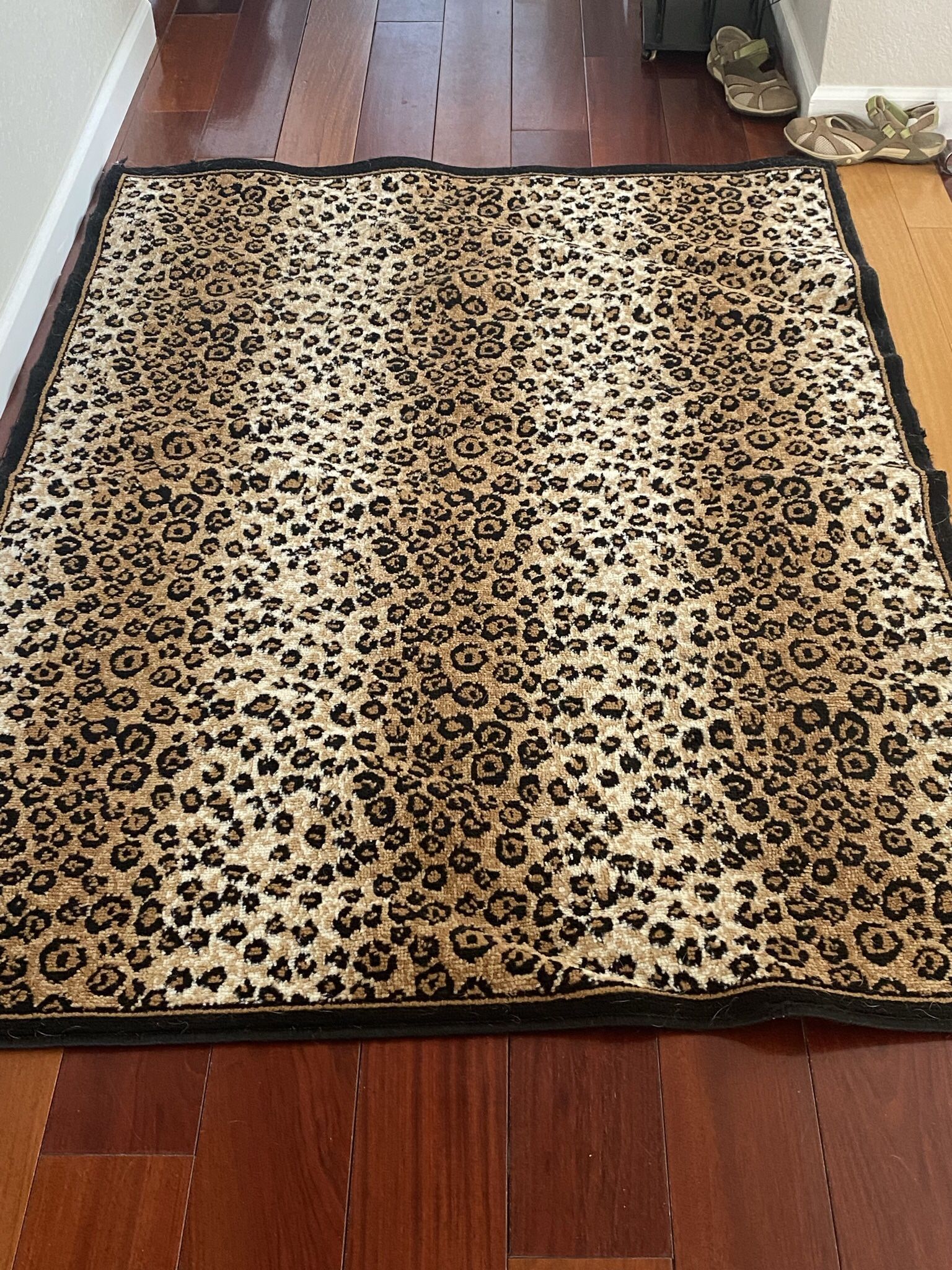 Leopard Area Rugs 4 X 5    ( 2)  Clean in great condition.$10   Each.   Custom Made Gorgeous fabric flower arrangement in unique vase. Large. $25