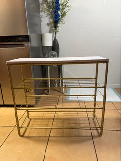✨ Modern gold metal clothing rack with built-in shelves for shoes, bags, boxes, or accessories.