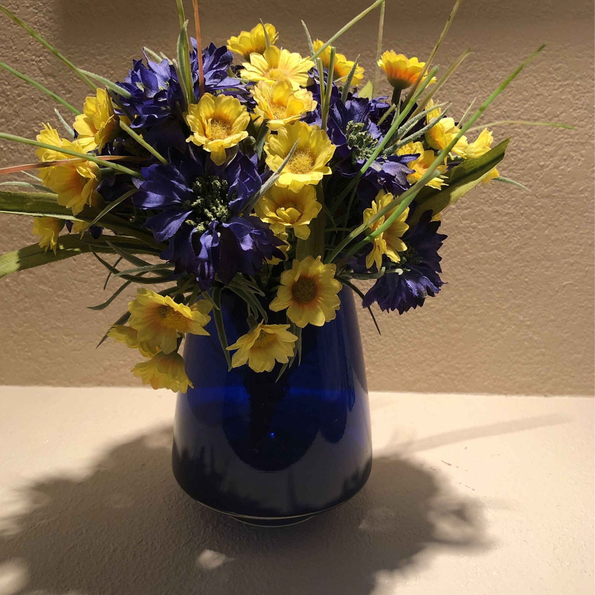 Blue & Yellow Flowers In Blue Vase