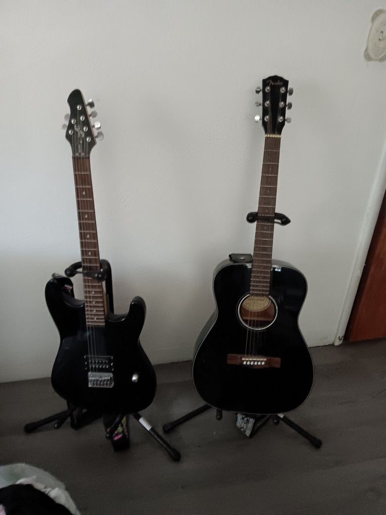 Two Guitars Electric And A Fender Guitar, Two Stands And Fender Box