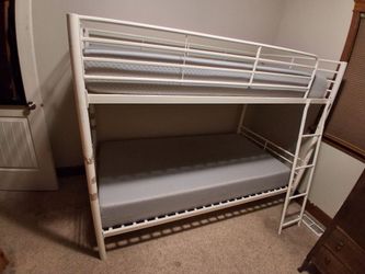 Mainstays Convertible Twin over Twin Metal Bunk Bed in white.