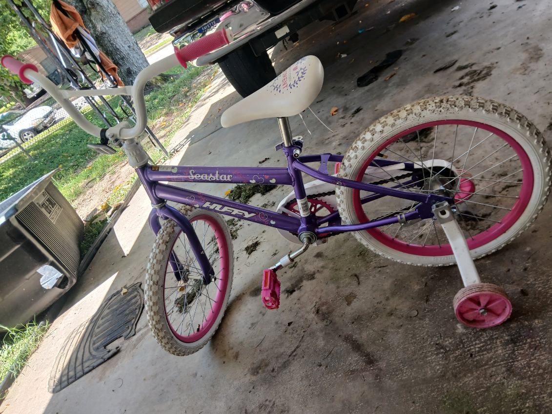 girl huffy bike with training wheels