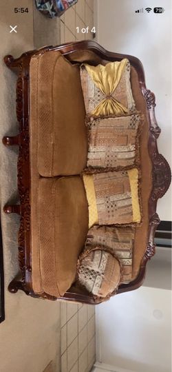 Brown embroidered sofas with real wood details