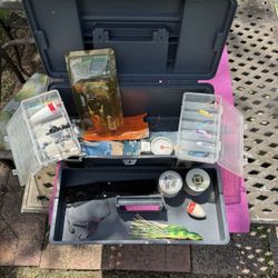 Fishing Tackle Box With Lots Of Lures And Gear 