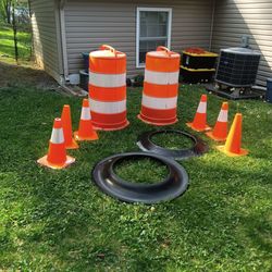 Eight construction cones two large six small