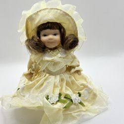 Porcelain doll in a white dress for a wedding