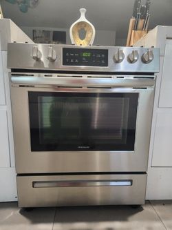 Stainless stove and brand new dishwasher