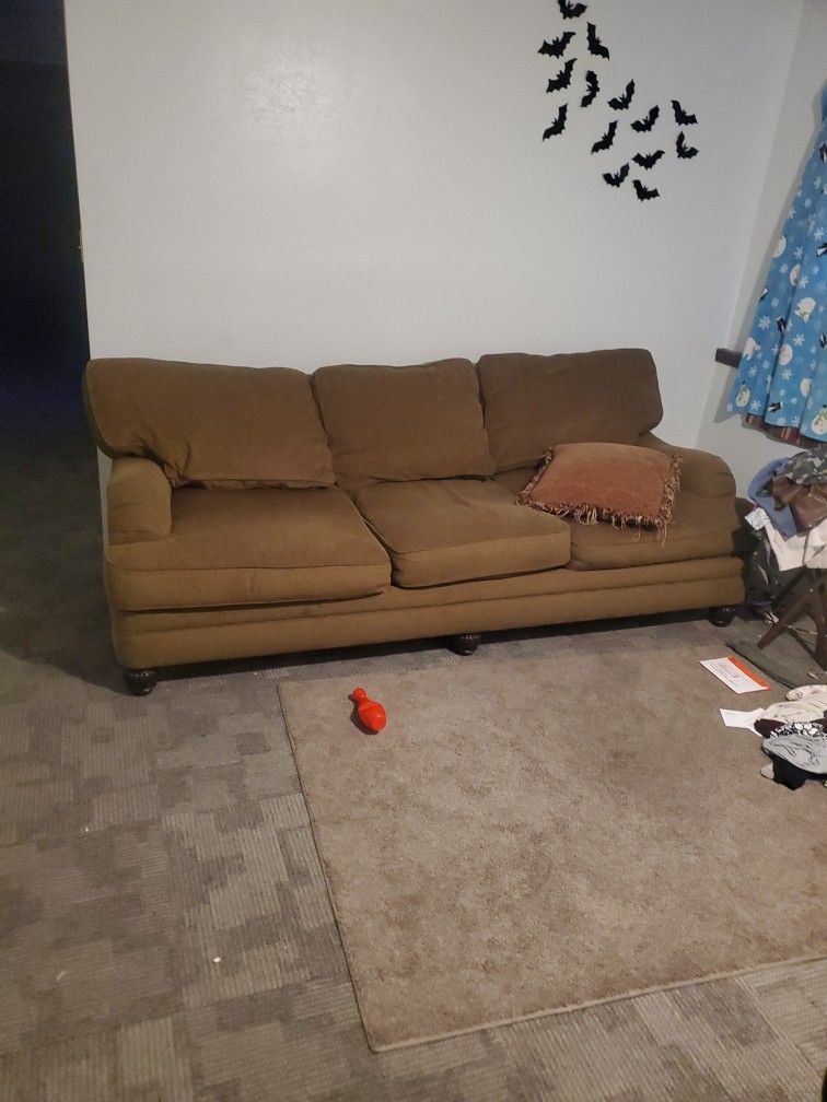 couch and loveseat with ottoman