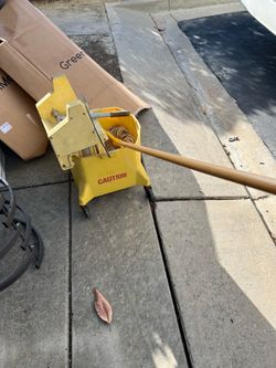Mop with bucket and brand new stick.  Extra mop heads