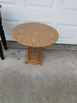 Round Two-Tier Wood Accent Table With An Oak-Look Finish