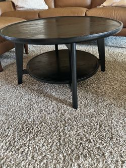 Round Black Wood Coffee Table with Lower Shelf