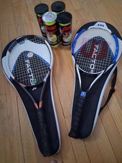 2 tennis rackets and balls