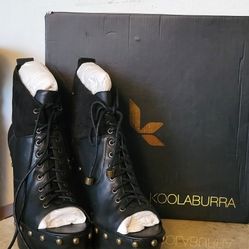 Black boots with metal inserts...5 inch heel...Size 8. by Koolaburra.