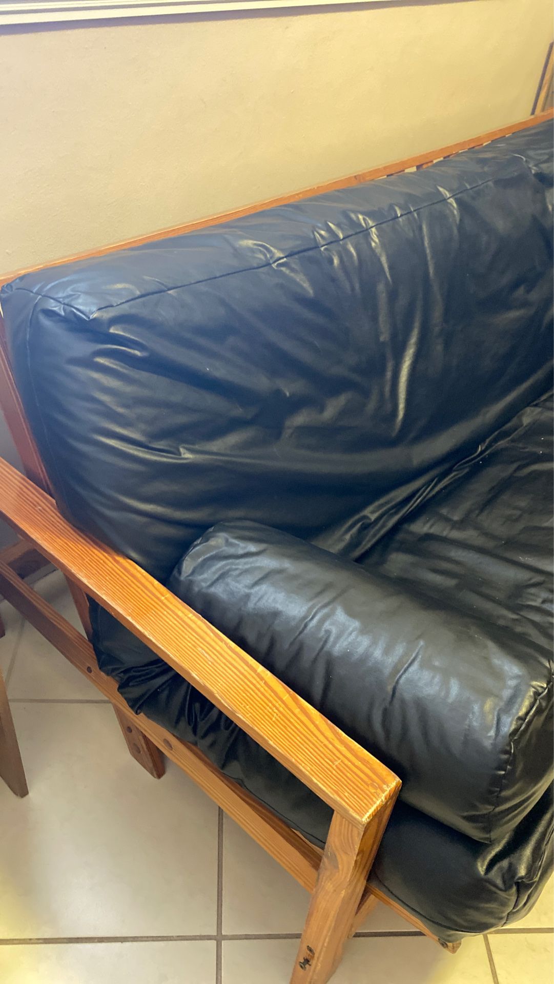 Futon with leather covering