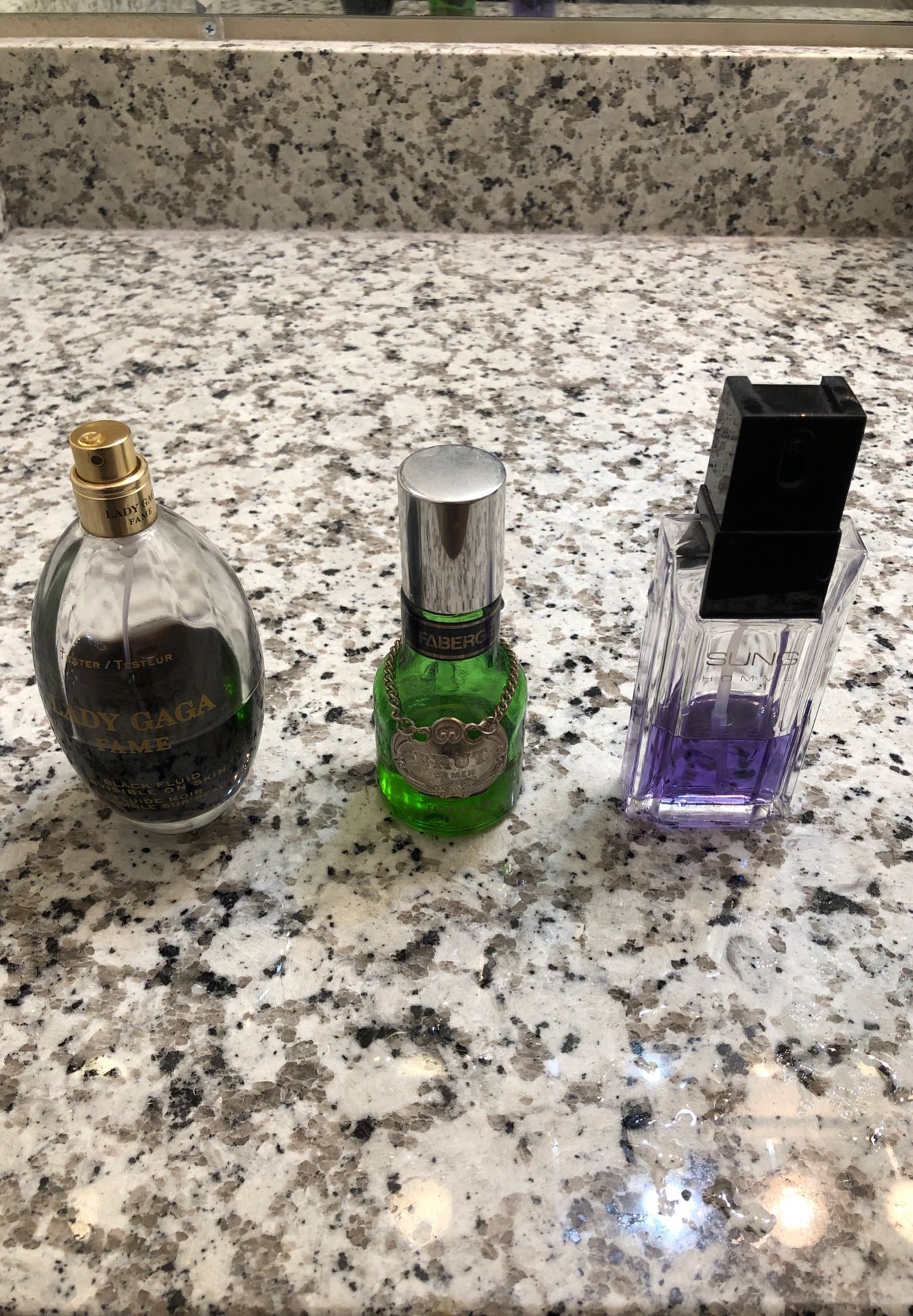 Three assorted men’s cologne