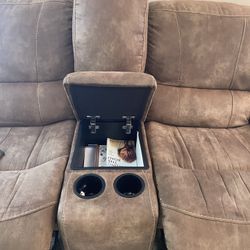 Reclining Couch With Center Storage And Cupholders