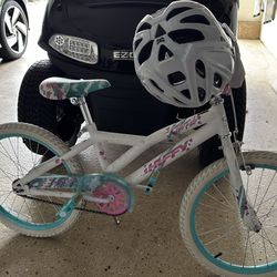 Huffy girls bike comes with white helmet.