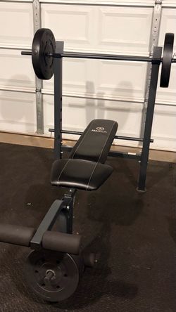 Weight Bench with Barbell and Weights