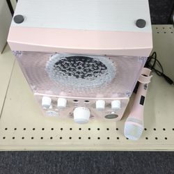 pink portable karaoke machine, likely designed for kids or adults seeking a compact and fun entertainment system. 