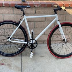 Fixie bicycle  Lasco crank set  Flip flop hub can ride on freewheel or fixed gear  Frame size 21 inches seat post to crank  700s wheel set deep V 