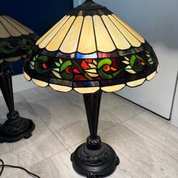 Vintage Stained glass lamps with bronze heavy bottom.18 “ wide x 25” high . $500 for both