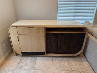 Modern bar cabinet with wine fridge and marble top