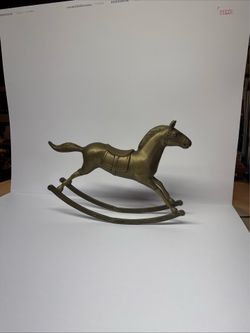 Vintage brass rocking horse sculpture