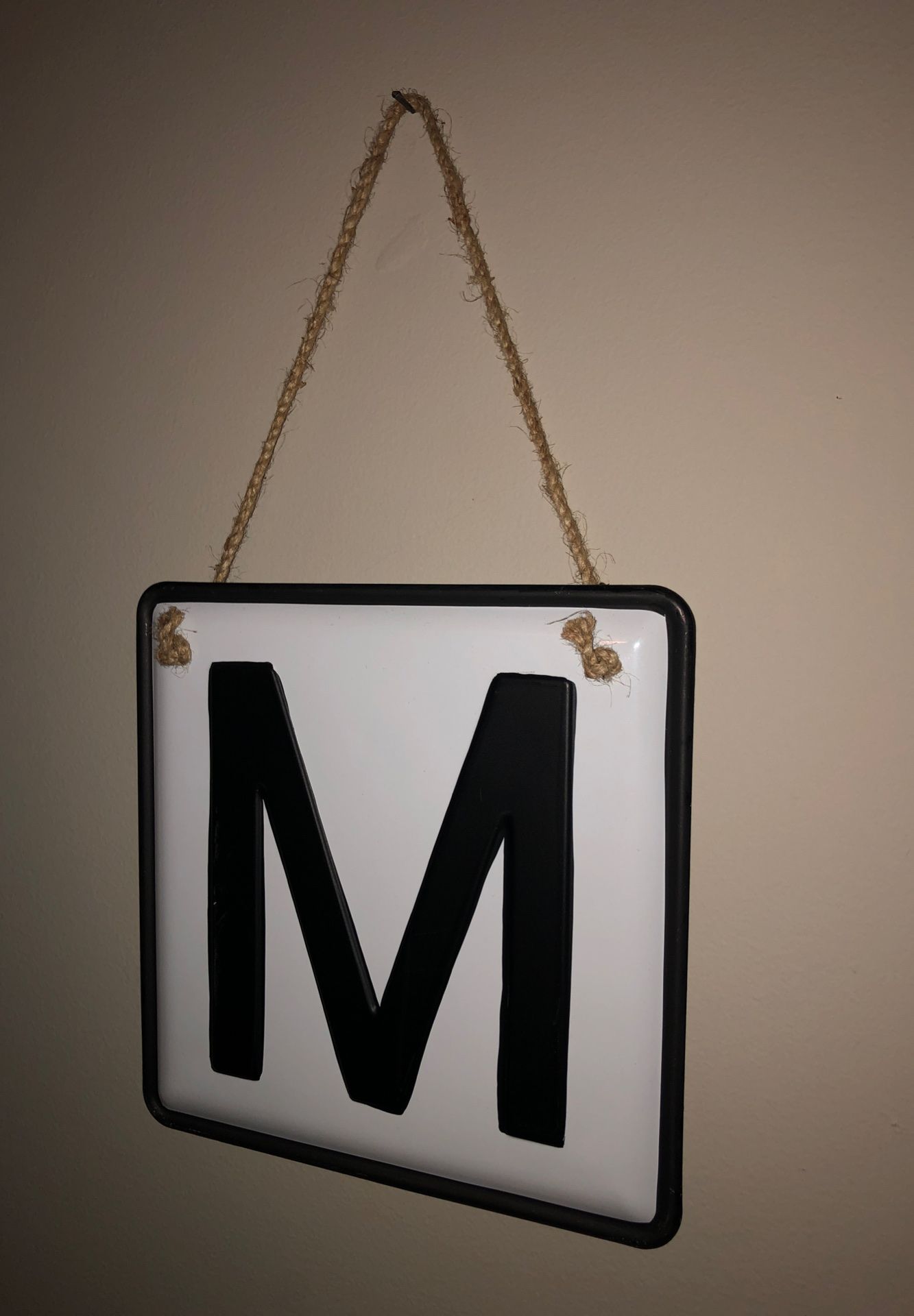 M sign