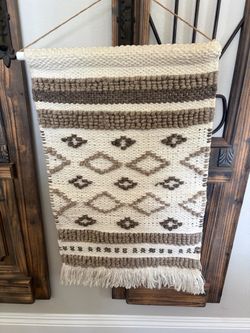 Macramé Crème and brown woven boho wall hanging featuring a geometric diamond pattern