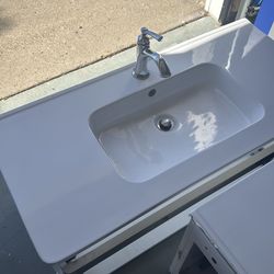 Two white bathroom vanity sinks  and vanity mirror