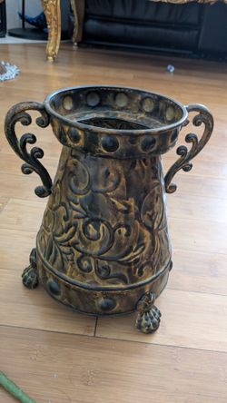 Metal vase with artificial sunflowers