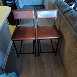 Brown leather bar chairs