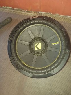 Kicker( 44cwcs124)CompC 12-inch subwoofer featuring signature yellow stitching on the surround.