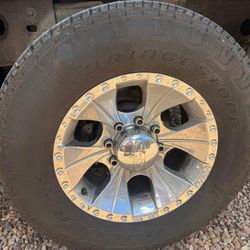 Raceline rims and Bridgestone dueler tires 265/70/17. Almost New