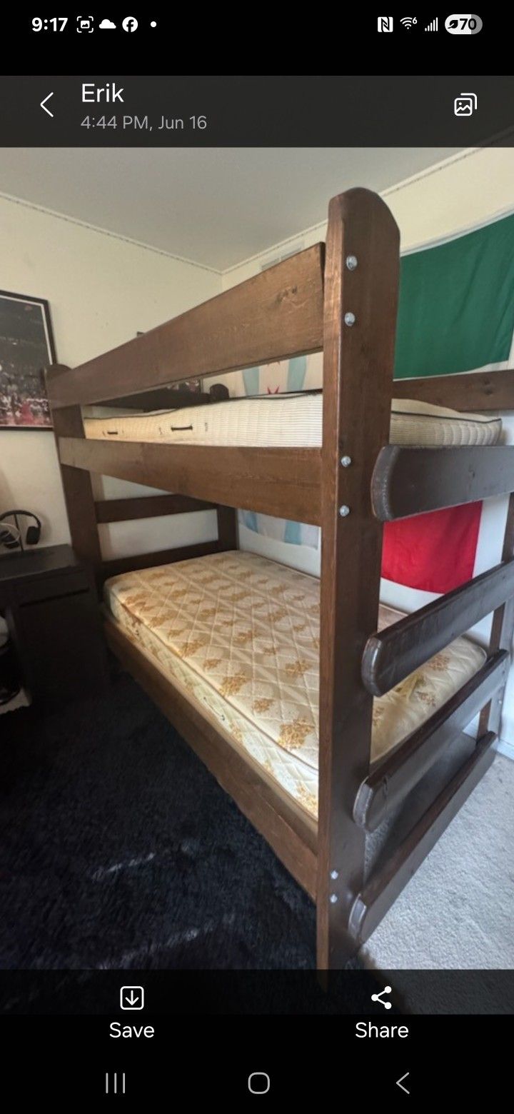 Bunk bed 2x6 bolted wood very solid , very sturdy, it comes with mattress.