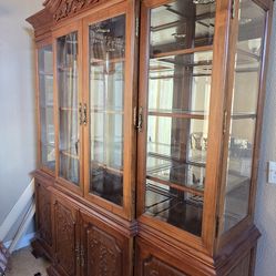 French Provincial-style lighted china cabinet or hutch