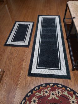 Two matching rugs