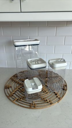 Set of four plastic storage containers with lids