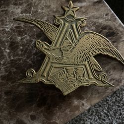 Vintage Heavy Brass BUDWEISER ANHEUSER BUSCH EAGLE A STAR EMBLEM SIGN. Measures approximately 7.5 x 9.5”. Has some areas wi the light tarnish. Please 