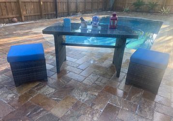 Patio Table and two ottomans.