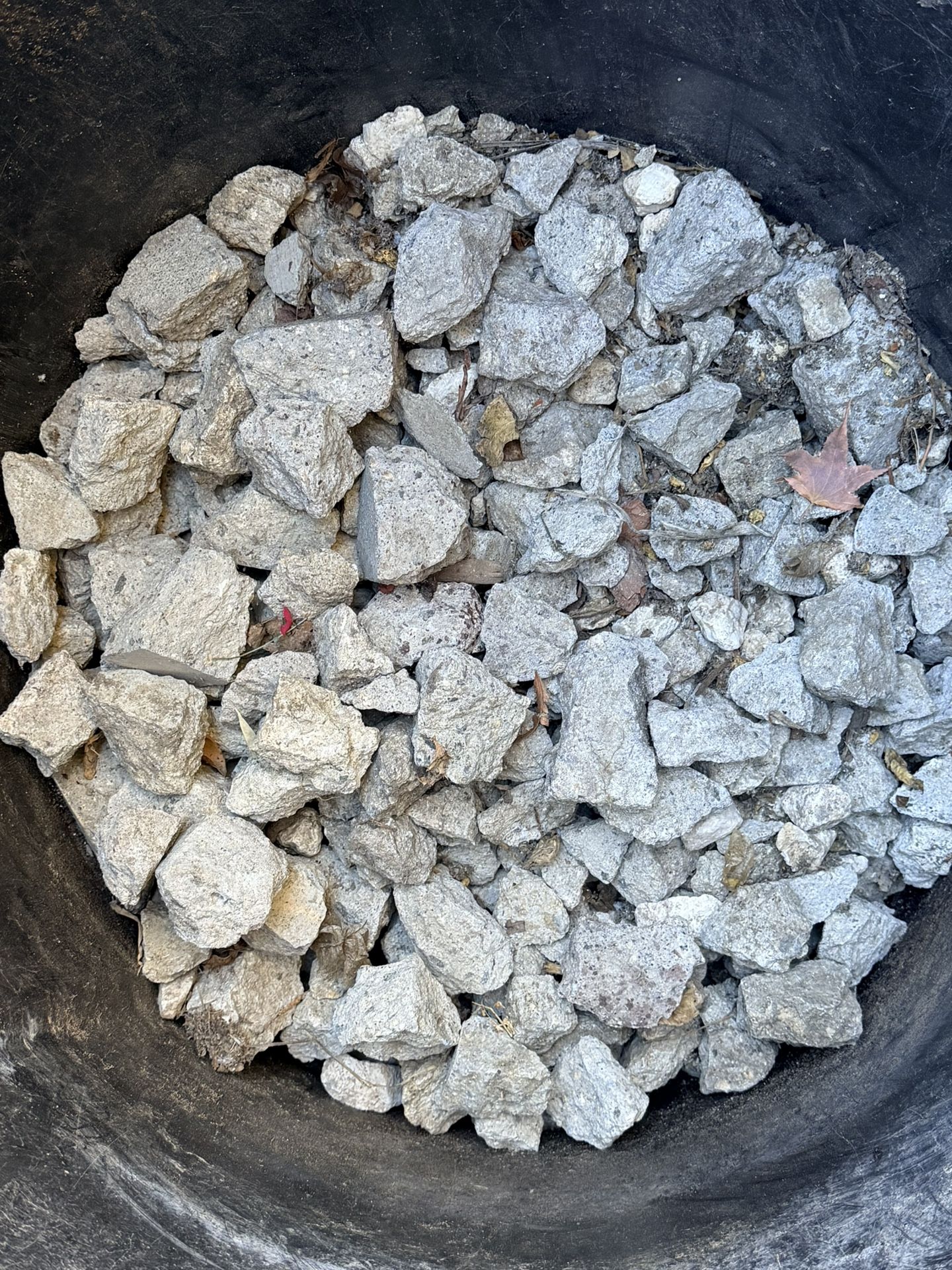 Large Drum Full Of Broken Concrete Rocks