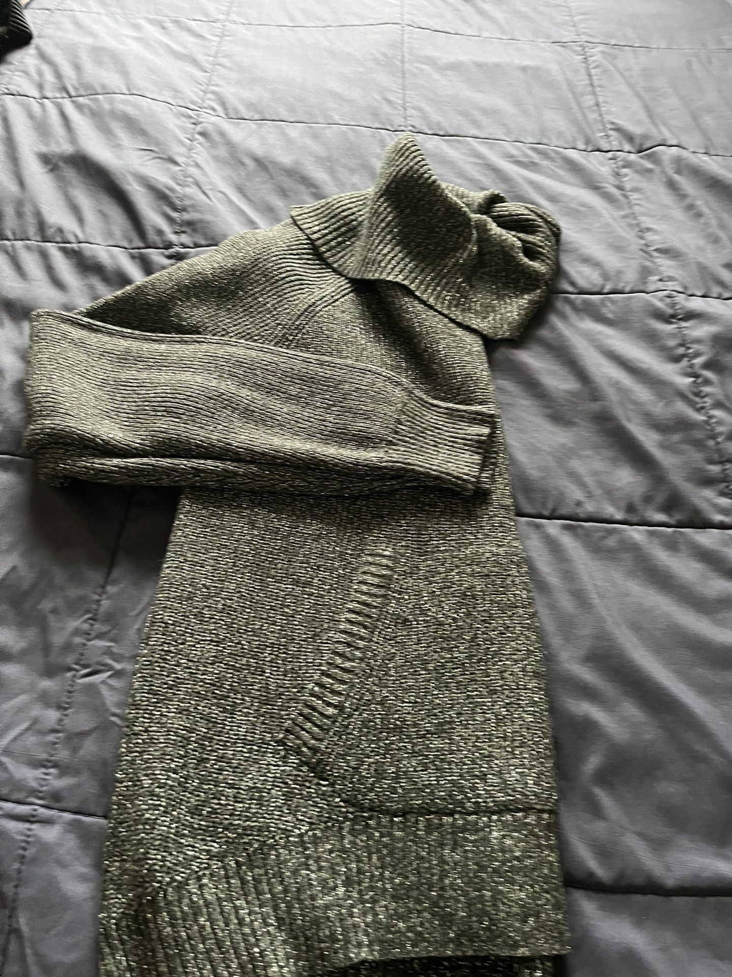 It’s Very Good Holiday Sweater In Size Medium. The Color Is Dark Gray With Sparkling On It. It’s For Women’s Made By NY& Company