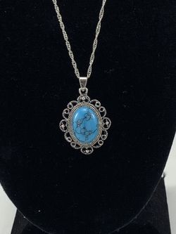 Blue natural stone pendant with silver tone necklace