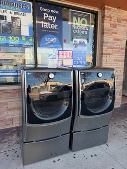 LG 4.5 Cu. Ft. Front Load Washer and 7.4 Cu. ft Gas Dryer with Pedestals