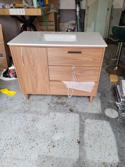 42 inch Brown vanity with stone top